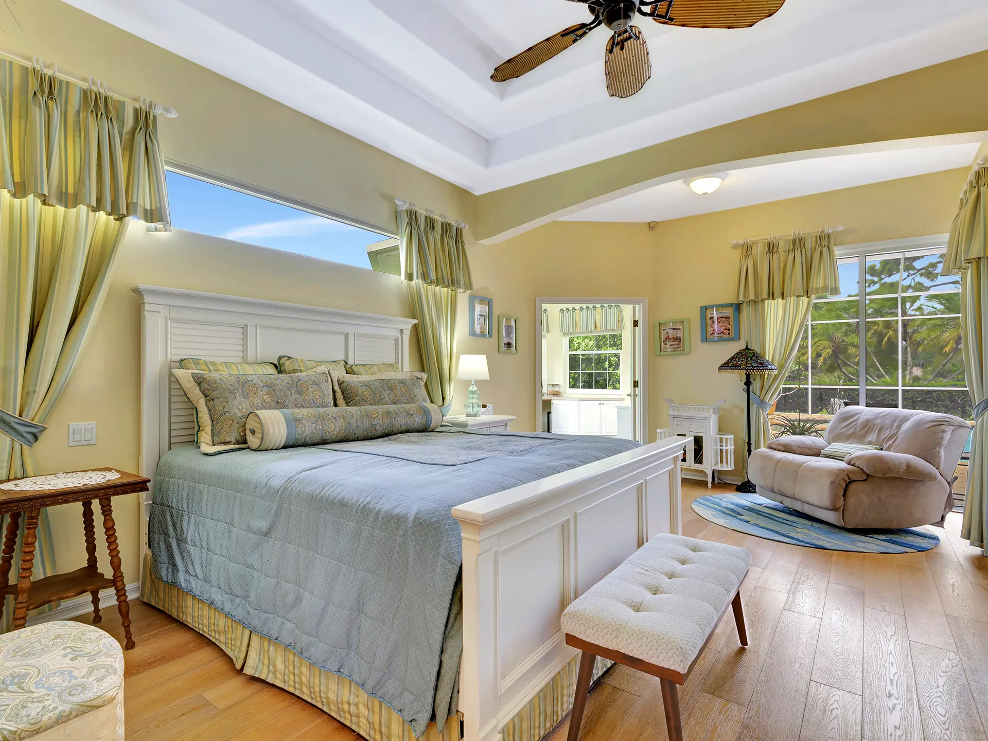 Luxury real estate interior photography of a master bedroom in Palmer Ranch, Sarasota, Florida, professionally captured by HDR Media Pro.